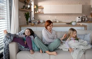 Family relaxing indoors thanks to furnace repair in Ocean County