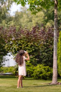 Girl inspecting Little Egg Harbor tree removal company service